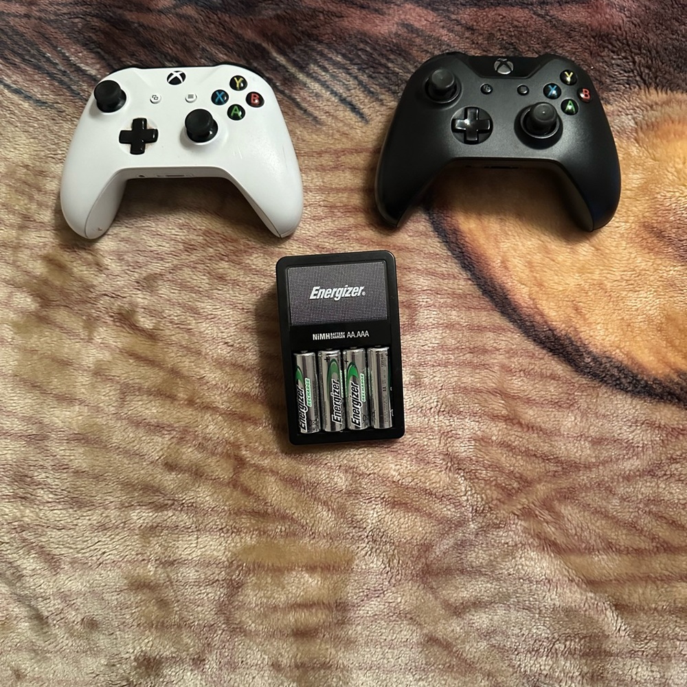 2 Xbox Controllers And recharging battery pack